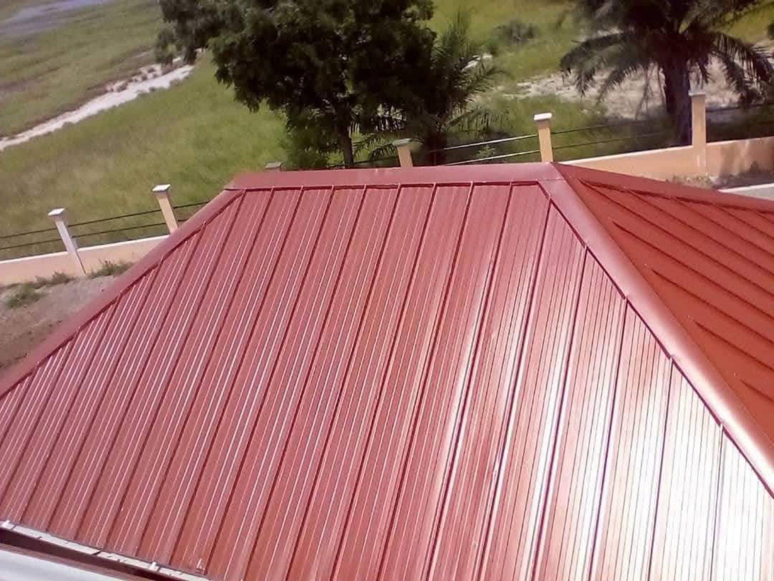 Red metal roof finish